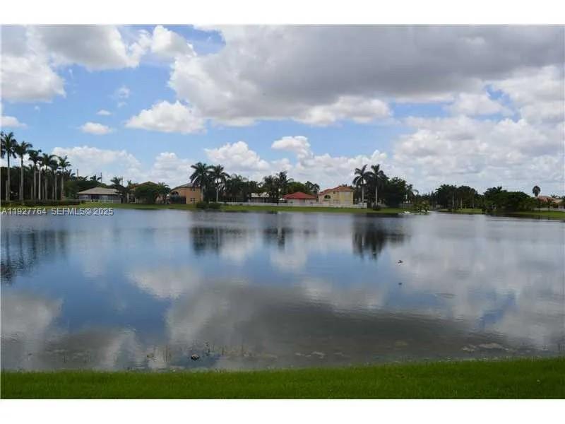 7132 Southwest 158th Path Miami, FL 33193 - Photo 11 of 21 a view of a lake with houses in the back