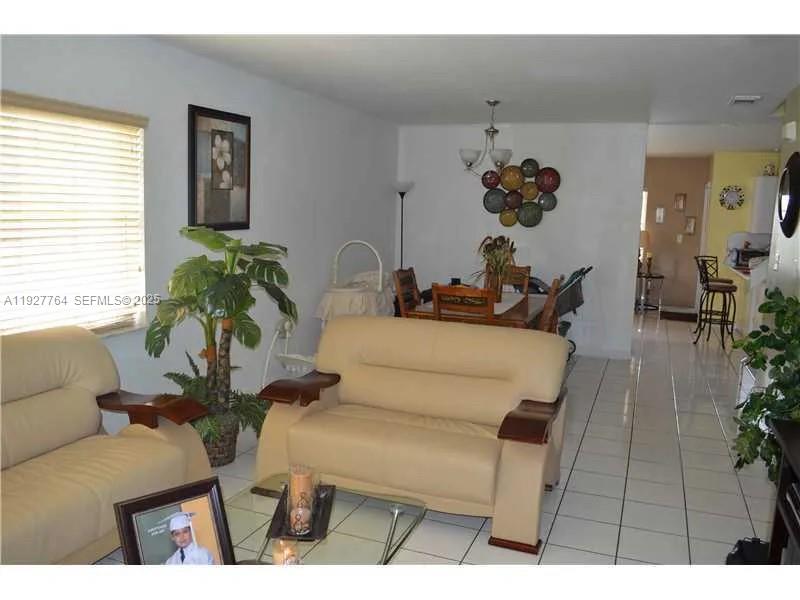 7132 Southwest 158th Path Miami, FL 33193 - Photo 15 of 21 a living room with furniture and a potted plant