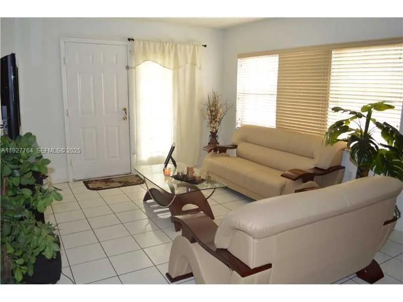 7132 Southwest 158th Path Miami, FL 33193 - Photo 18 of 21 a living room with furniture and a potted plant