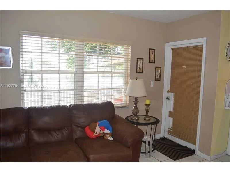 7132 Southwest 158th Path Miami, FL 33193 - Photo 4 of 21 a living room with furniture and a window