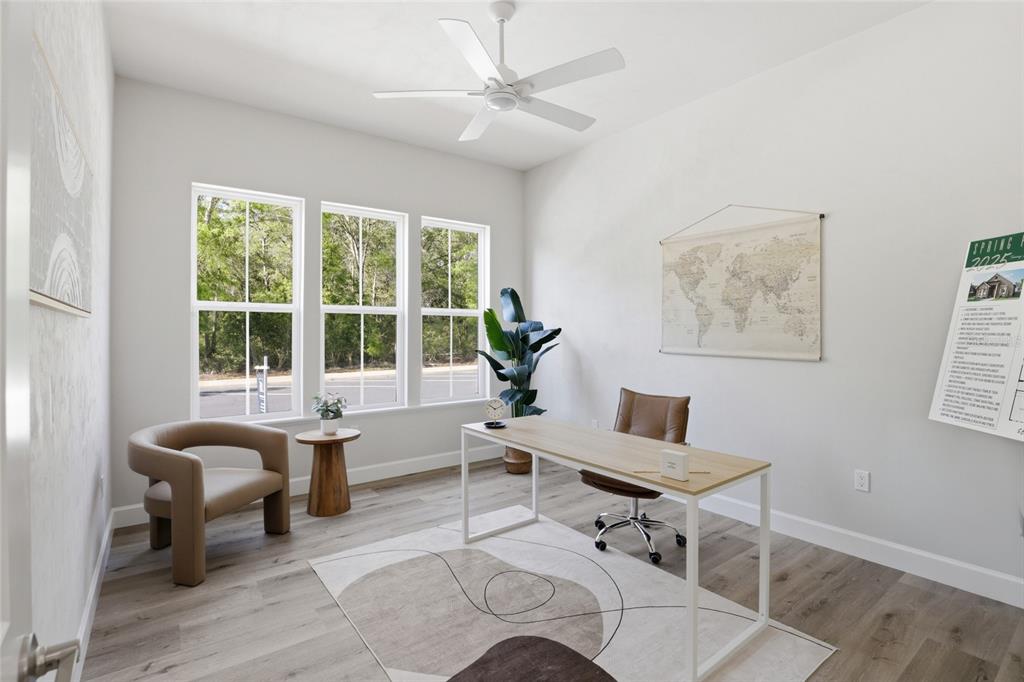 13425 Southwest 9th Road Newberry, FL 32669 - Photo 24 of 46 a living room with furniture and a large window