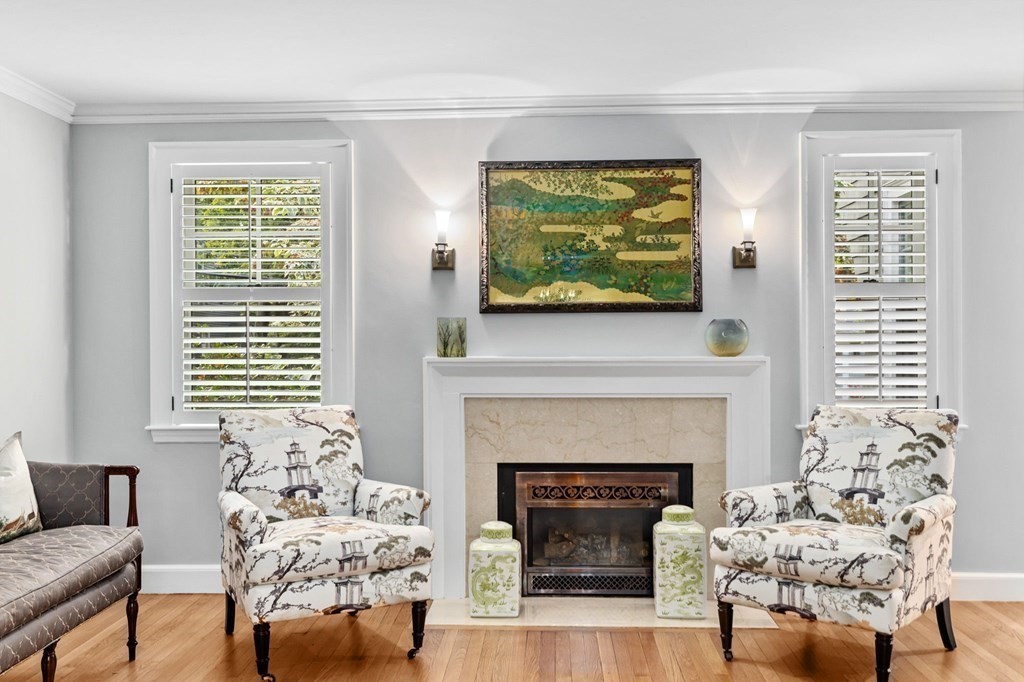 21 Nantucket Road Newton, MA 02461 - Photo 3 of 31 a living room with furniture a fireplace and a flat screen tv