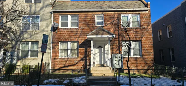 front view of a house with a street