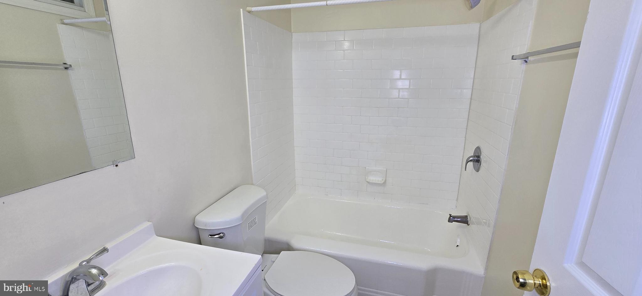 1516 F Street Northeast, Unit 3 Washington, DC 20002 - Photo 5 of 14 a white toilet sitting next to a bath tub