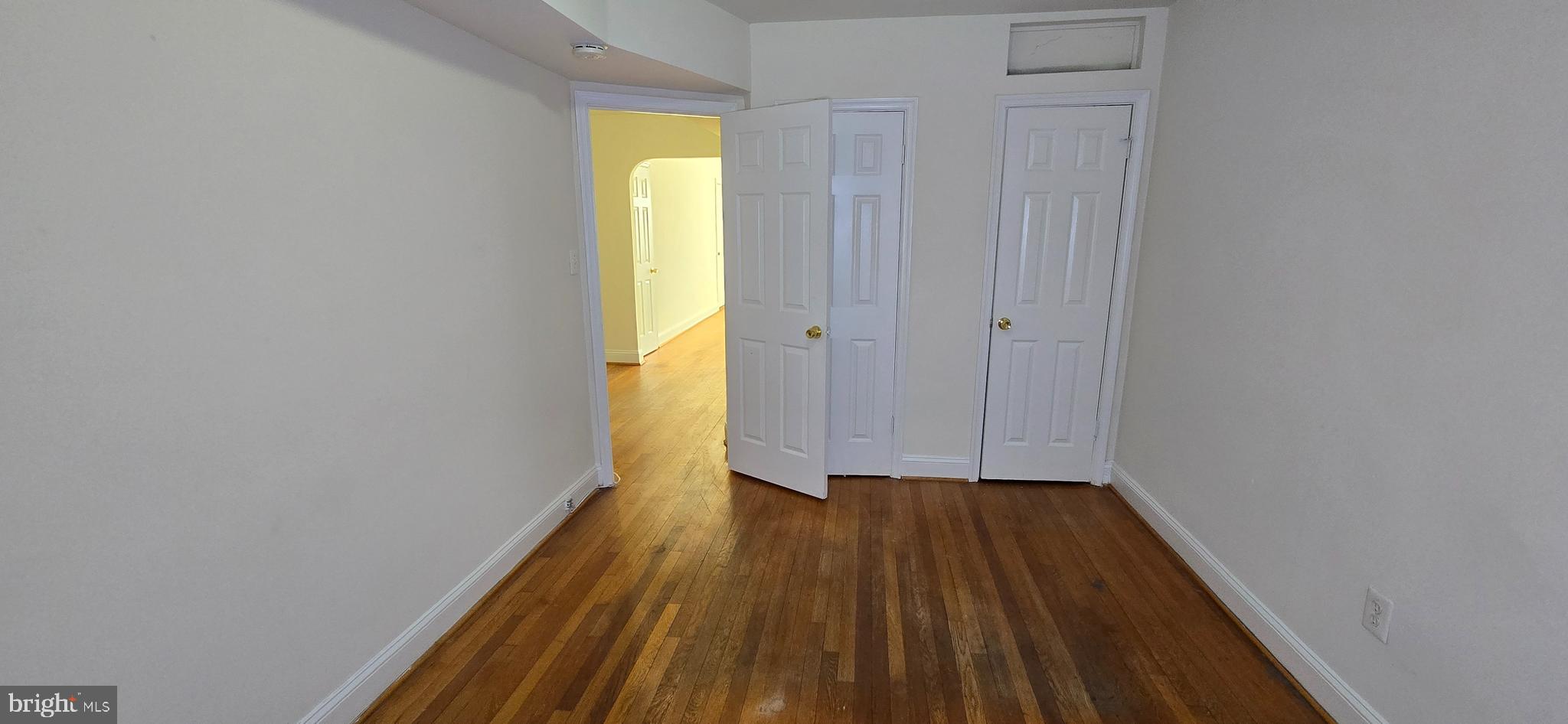 1516 F Street Northeast, Unit 3 Washington, DC 20002 - Photo 6 of 14 a view of wooden floor in a room with a window
