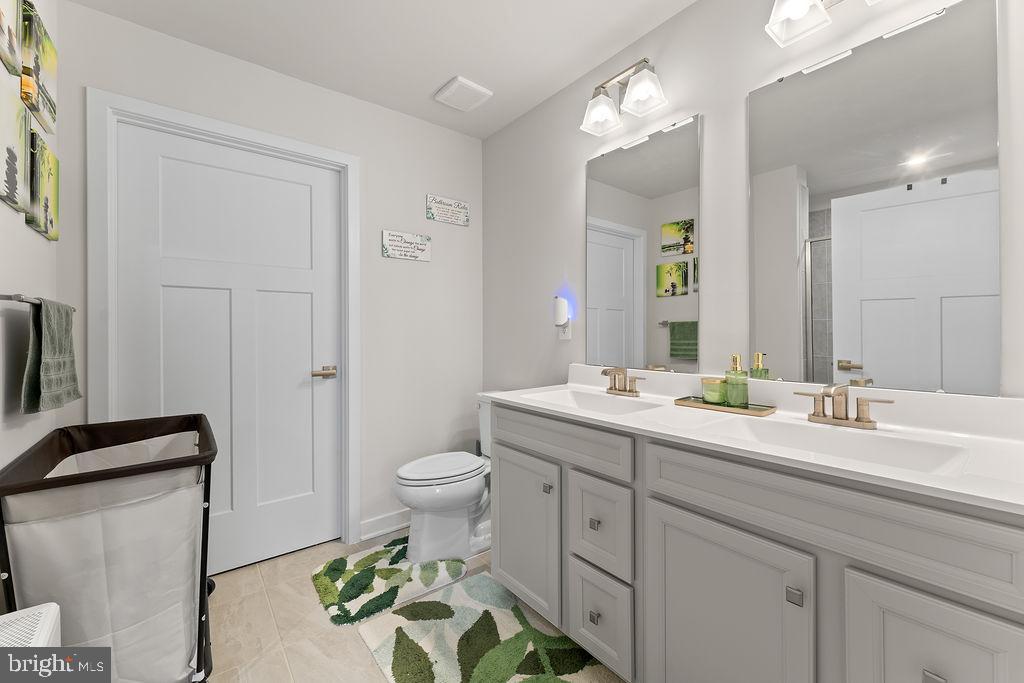 18368 Centennial Circle Ruther Glen, VA 22546 - Photo 19 of 45 a bathroom with a granite countertop sink mirror and toilet