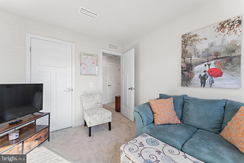 18368 Centennial Circle Ruther Glen, VA 22546 - Photo 24 of 45 a living room with furniture and a flat screen tv
