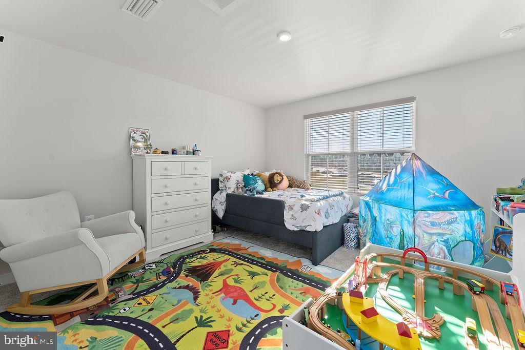 18368 Centennial Circle Ruther Glen, VA 22546 - Photo 25 of 45 a bedroom with furniture and a wooden floor