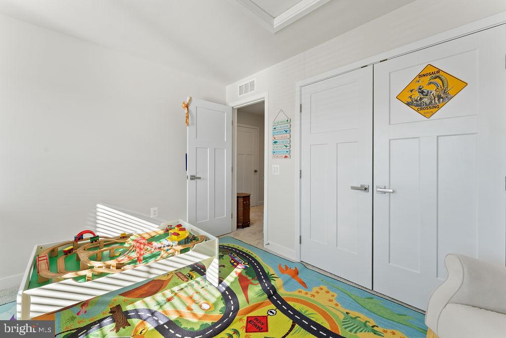 18368 Centennial Circle Ruther Glen, VA 22546 - Photo 26 of 45 a bedroom with bed and storage