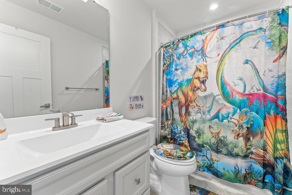 18368 Centennial Circle Ruther Glen, VA 22546 - Photo 27 of 45 a bathroom with a sink and a mirror