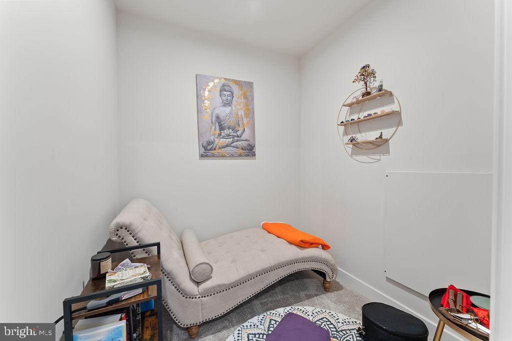 18368 Centennial Circle Ruther Glen, VA 22546 - Photo 28 of 45 a bedroom with a bed and a chandelier