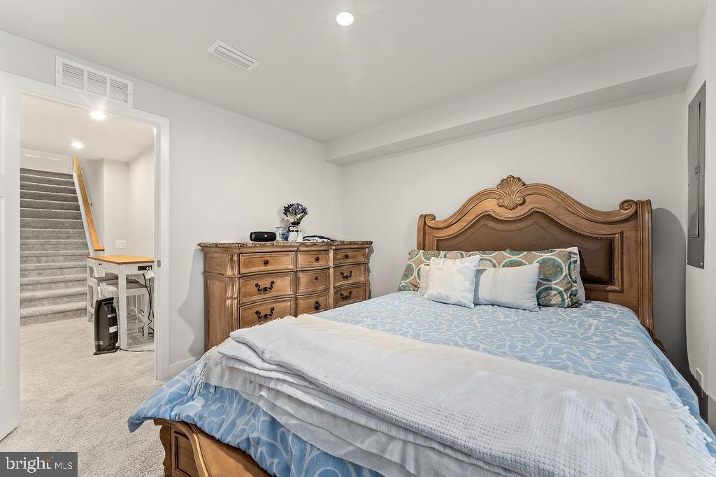 18368 Centennial Circle Ruther Glen, VA 22546 - Photo 31 of 45 a bedroom with a bed and a cabinets