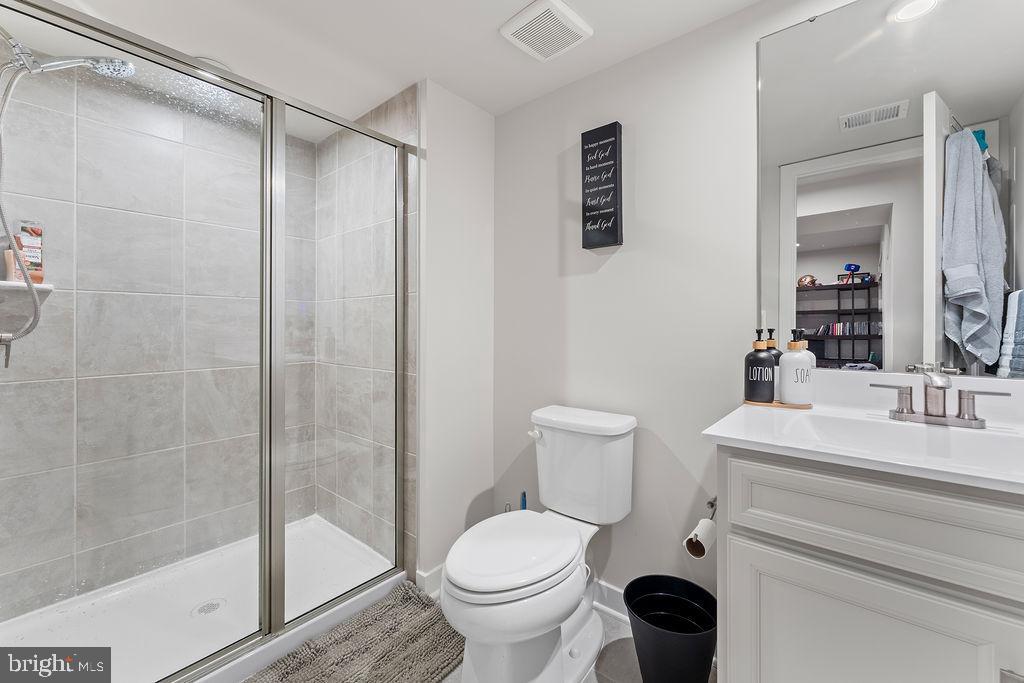 18368 Centennial Circle Ruther Glen, VA 22546 - Photo 32 of 45 a bathroom with a sink toilet and shower