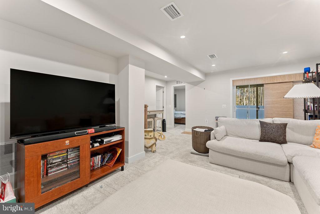 18368 Centennial Circle Ruther Glen, VA 22546 - Photo 36 of 45 a living room with furniture and a flat screen tv