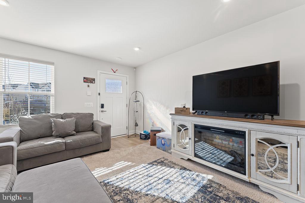 18368 Centennial Circle Ruther Glen, VA 22546 - Photo 4 of 45 a living room with furniture and a flat screen tv