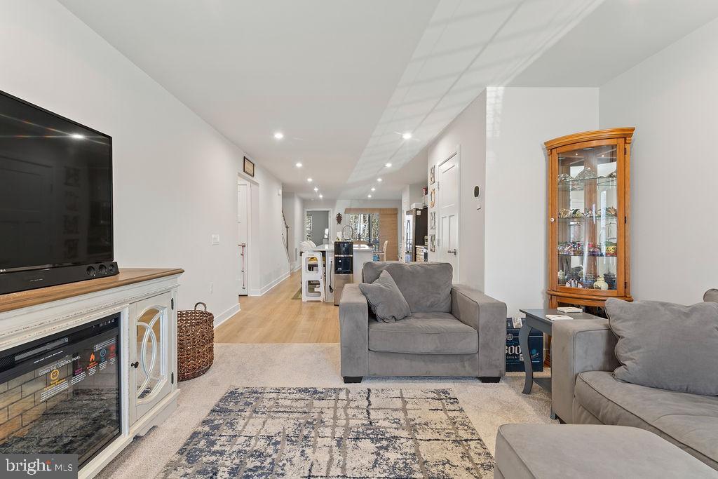 18368 Centennial Circle Ruther Glen, VA 22546 - Photo 45 of 45 a living room with furniture and a flat screen tv