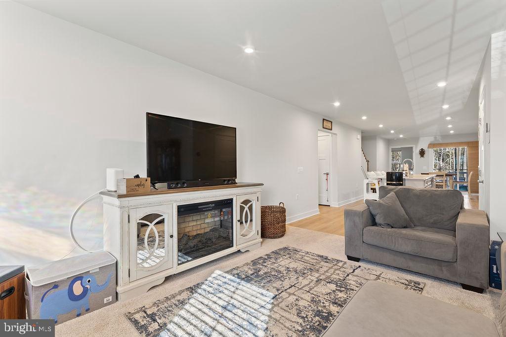 18368 Centennial Circle Ruther Glen, VA 22546 - Photo 7 of 45 a living room with furniture and a flat screen tv