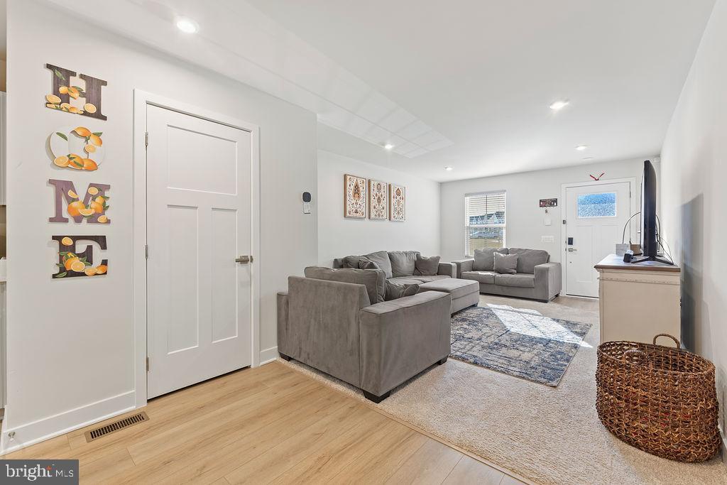 18368 Centennial Circle Ruther Glen, VA 22546 - Photo 8 of 45 a living room with furniture and a lamp