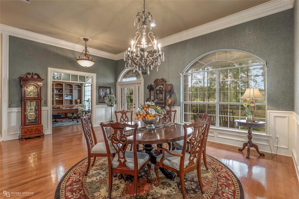 400 Crouch Road Benton, LA 71006 - Photo 11 of 40 a view of a dining room with furniture window and wooden floor