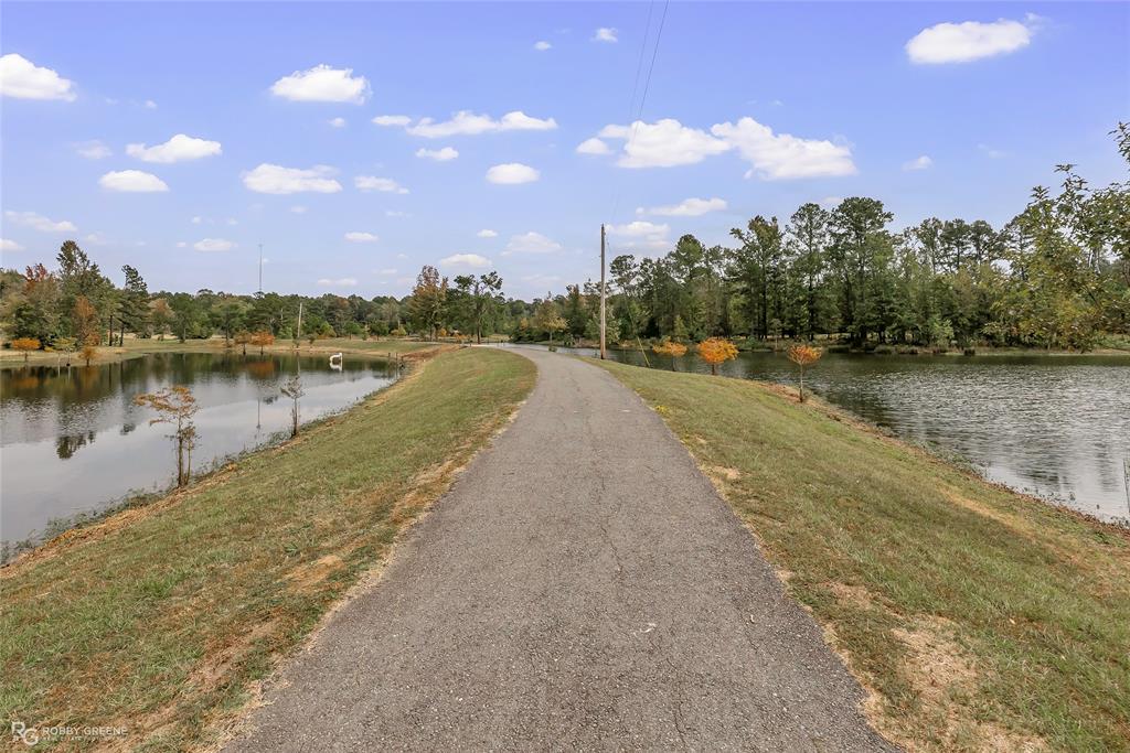 400 Crouch Road Benton, LA 71006 - Photo 2 of 40 a view of a lake with houses in the back