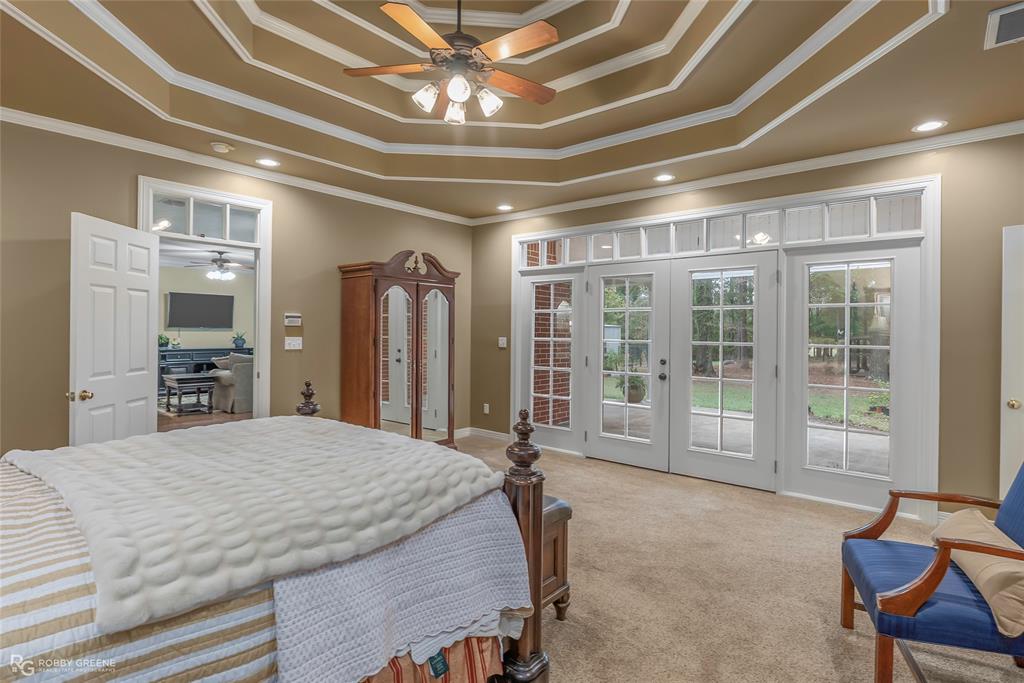 400 Crouch Road Benton, LA 71006 - Photo 23 of 40 Living room with ornamental molding, a ceiling fan, wood finished floors, french doors, and a sunroom