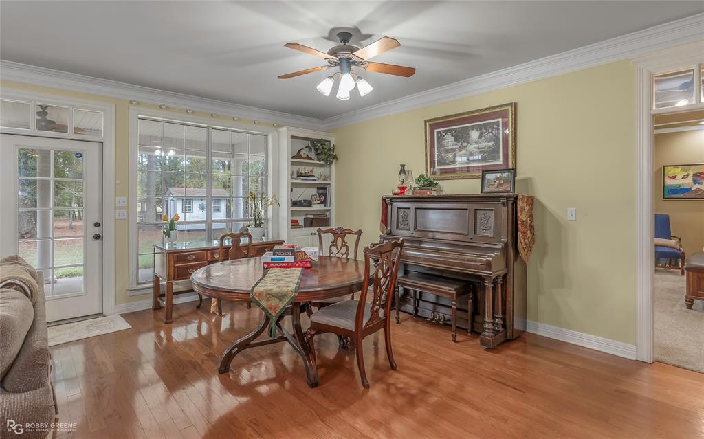 400 Crouch Road Benton, LA 71006 - Photo 31 of 40 Full bath featuring vanity, wallpapered walls, shower / bath combination with curtain, and ornamental molding
