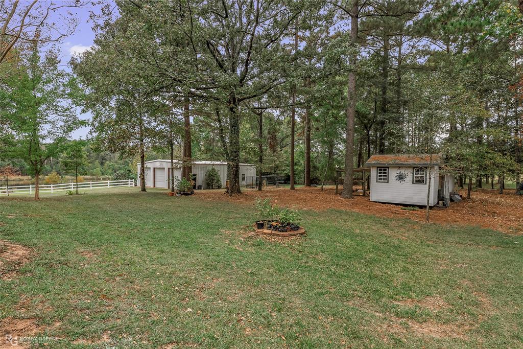 400 Crouch Road Benton, LA 71006 - Photo 37 of 40 Detached garage featuring view of wooded area