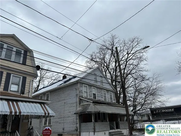 a view of a building with a tree