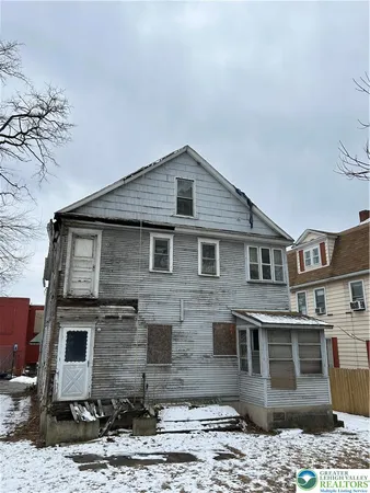 a front view of a house with yard