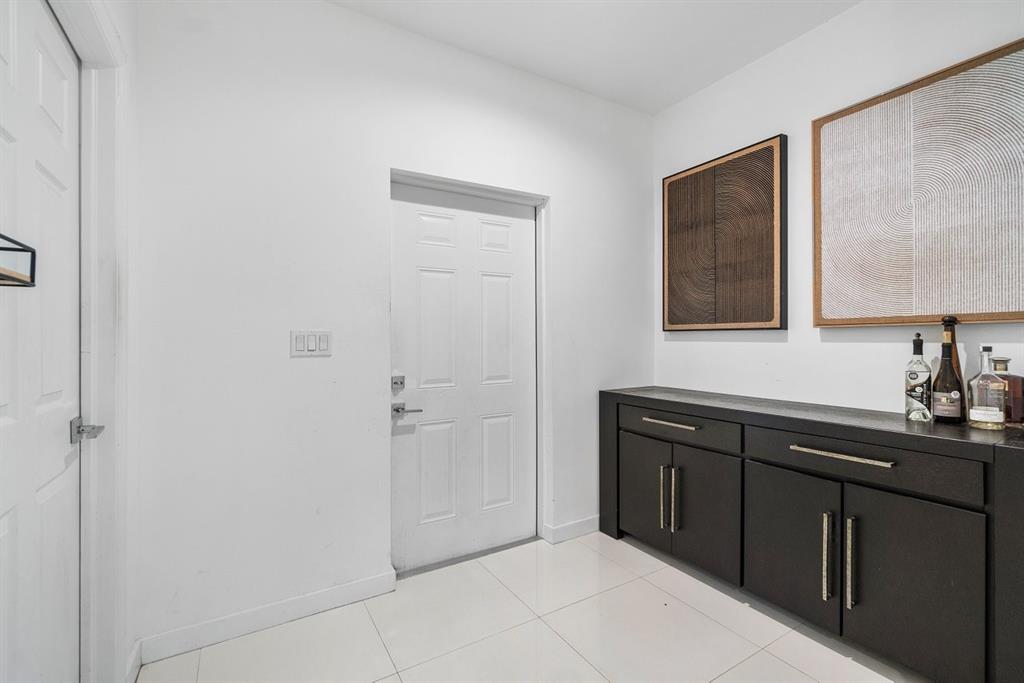 1030 Crystal Way, Unit 104 Delray Beach, FL 33444 - Photo 12 of 44 a bathroom with a sink and mirror