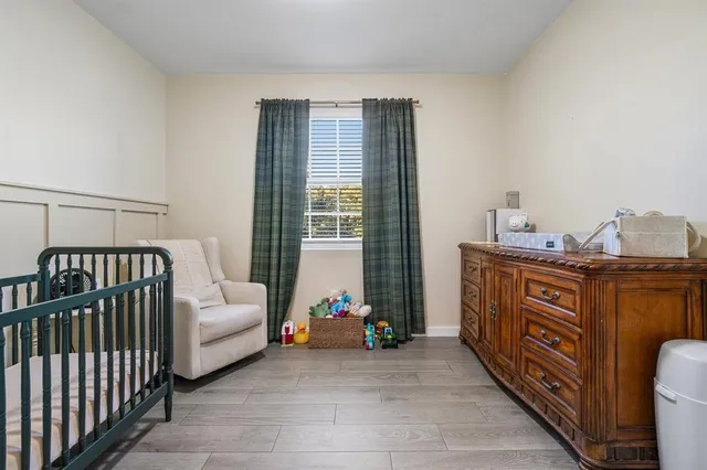 a bedroom with furniture and a window