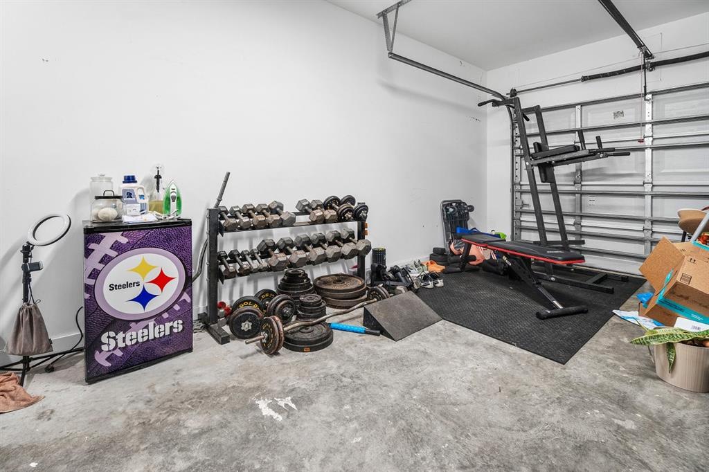 1030 Crystal Way, Unit 104 Delray Beach, FL 33444 - Photo 23 of 44 a view of a room with gym equipment