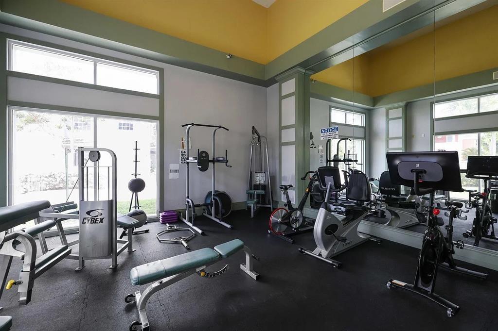 1030 Crystal Way, Unit 104 Delray Beach, FL 33444 - Photo 30 of 44 a view of a room with gym equipment