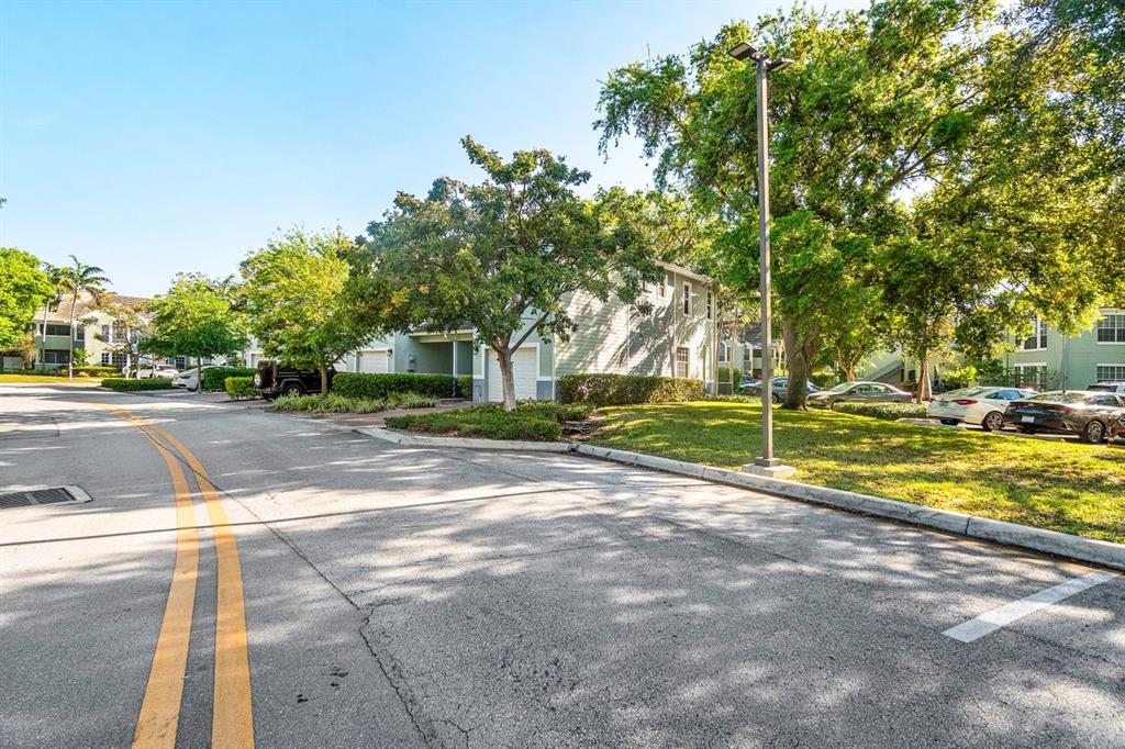 1030 Crystal Way, Unit 104 Delray Beach, FL 33444 - Photo 36 of 44 a view of a playground with basketball court
