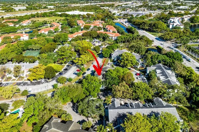a view of backyard with outdoor seating and green space