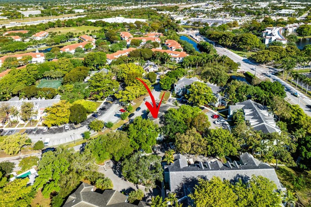1030 Crystal Way, Unit 104 Delray Beach, FL 33444 - Photo 38 of 44 an aerial view of residential houses with outdoor space and trees