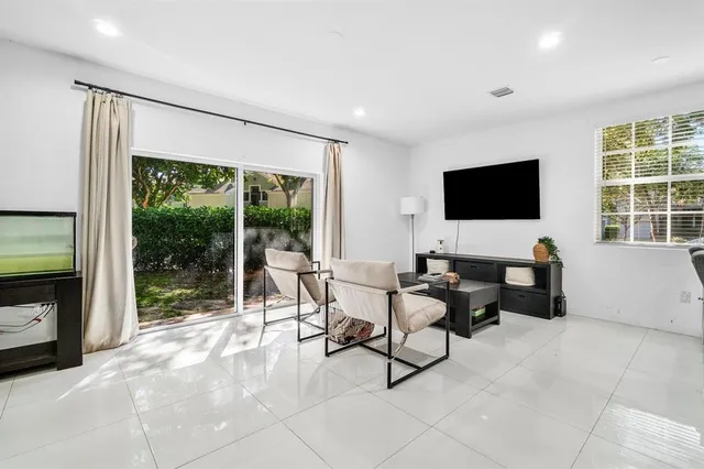 a workspace with furniture and large windows