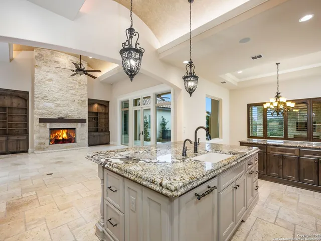 a spacious bathroom with a granite countertop sink mirror and shower