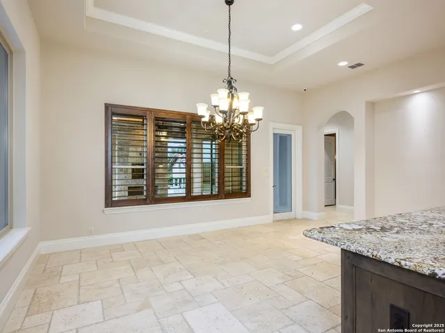 wooden floor in an empty room with a fireplace