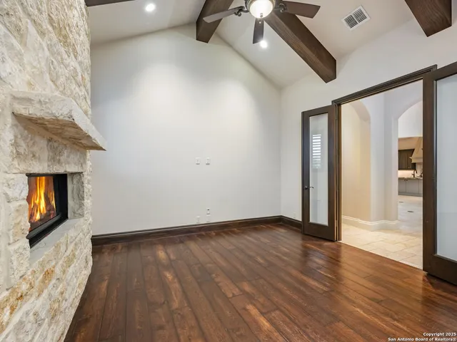 a view of a big yard with a house in the background