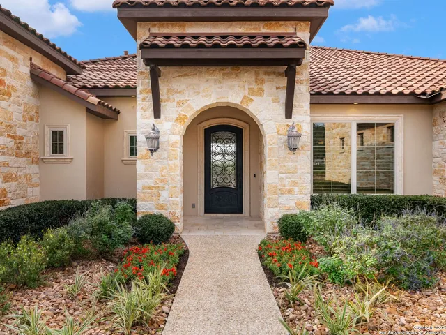 an empty room with windows and entrance