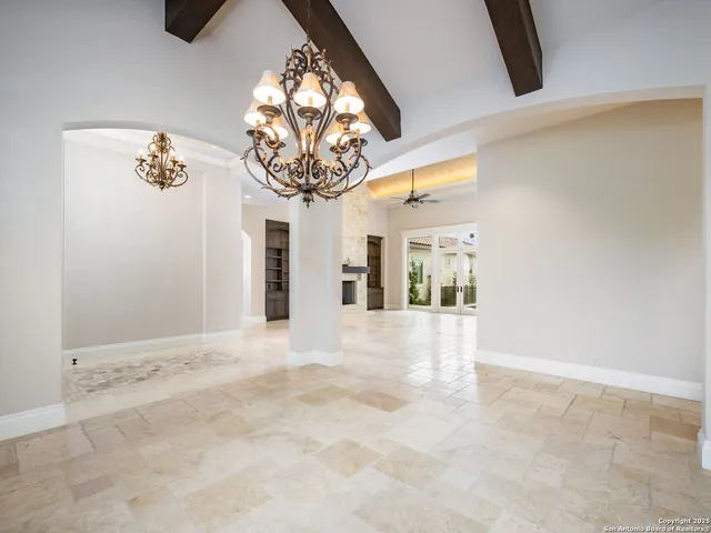 a view of a livingroom with a fireplace and window