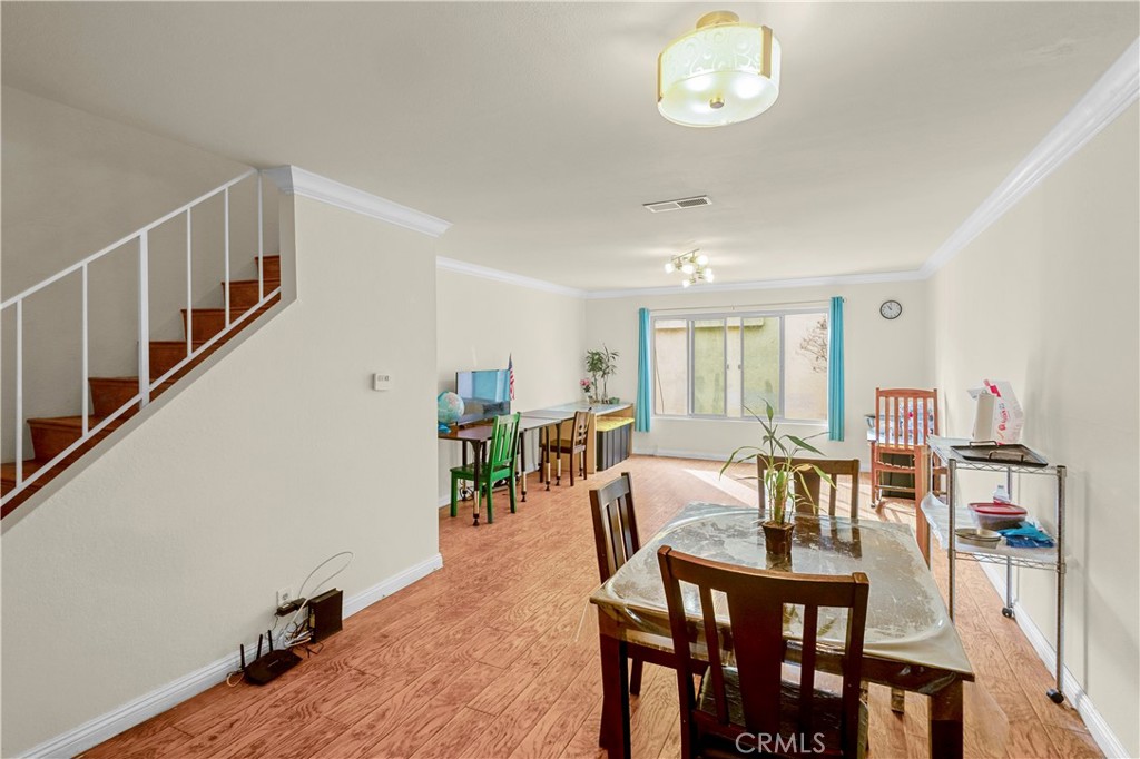 1791 Neil Armstrong Street, Unit 103 Montebello, CA 90640 - Photo 20 of 33 a view of a dining room with furniture