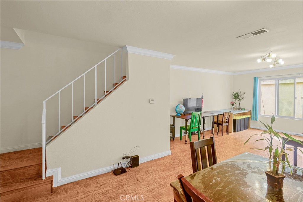 1791 Neil Armstrong Street, Unit 103 Montebello, CA 90640 - Photo 21 of 33 a living room with furniture and a table