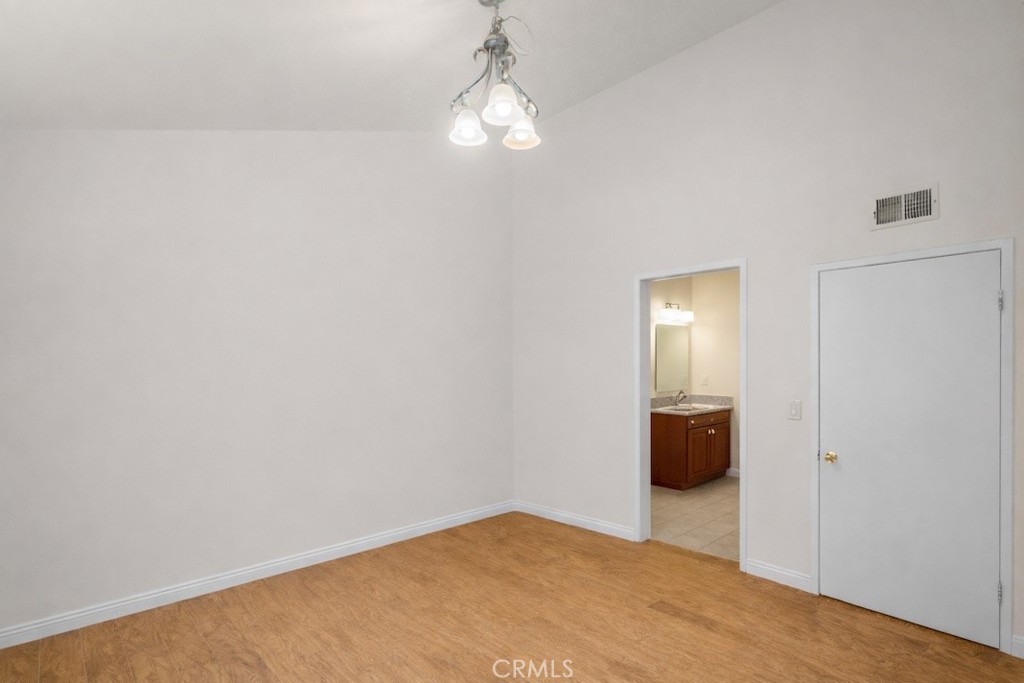 1791 Neil Armstrong Street, Unit 103 Montebello, CA 90640 - Photo 24 of 33 a view of a room with wooden floor and windows