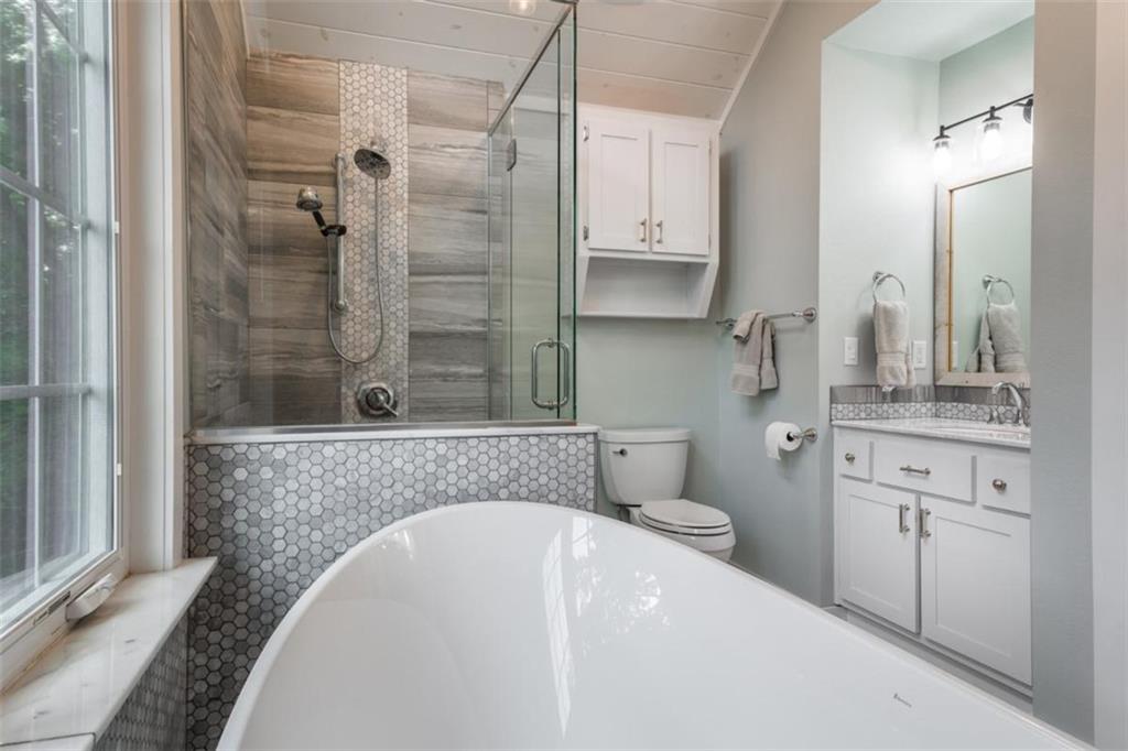 349 Moon Shadow View North Blairsville, GA 30512 - Photo 34 of 74 a bathroom with a tub sink and mirror
