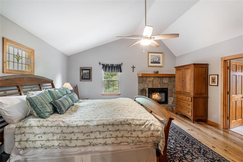 349 Moon Shadow View North Blairsville, GA 30512 - Photo 39 of 74 a bedroom with a bed and a fireplace