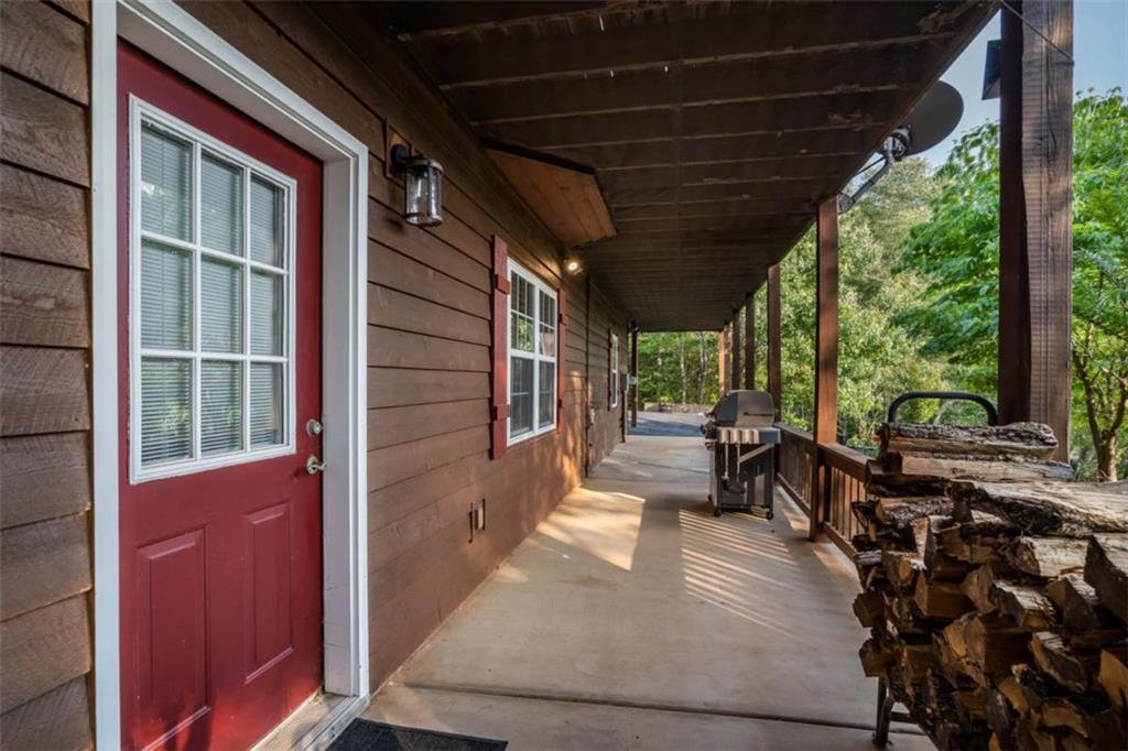 349 Moon Shadow View North Blairsville, GA 30512 - Photo 68 of 74 a view of a porch with wooden floor and furniture