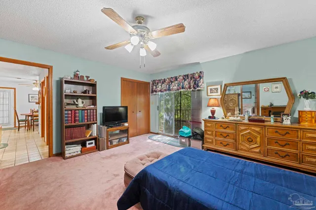 a bed room with a bed and a television