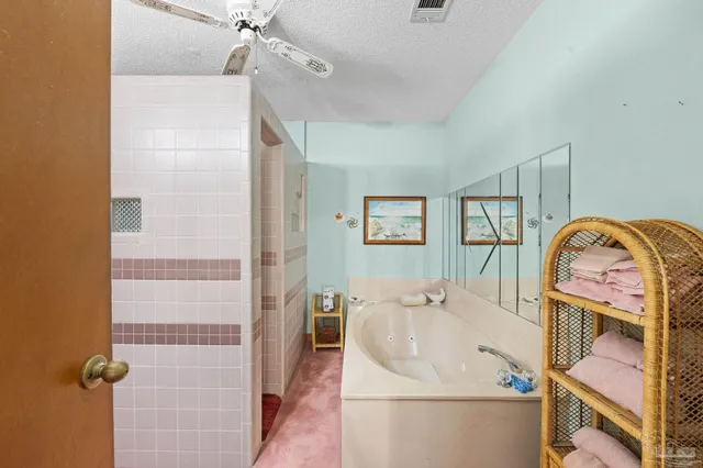 a bathroom with a sink a mirror and shower